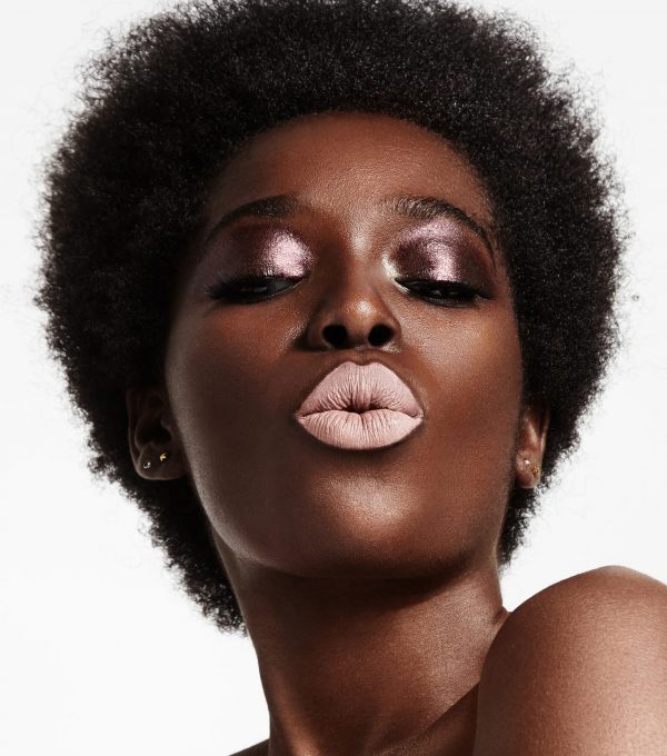 black woman with a short afra and bright lips
